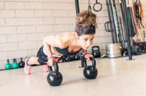 bigstock Woman Making Push Ups On The K 89664608 300x198 - Woman Making Push Ups On The Kettle Bells