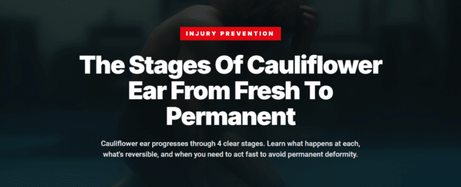 Wrestler checking ear after training session on gym mats