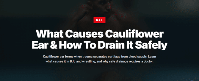 Wrestler checking ear for cauliflower ear injury after grappling training session